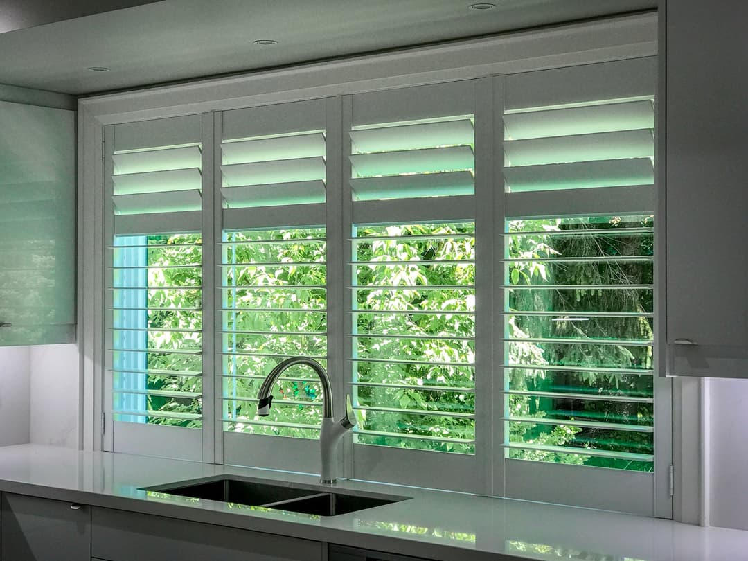 California shutters in living room with natural light - GTA installation
